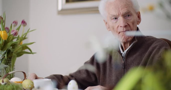 Senior Man, Retirement. Lonley Senior Man Siting Alone at Table