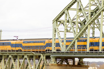 Train on rail bridge in Arnhem, the Netherlands