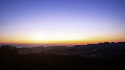 sunrise on horizontal line of mountain for waking