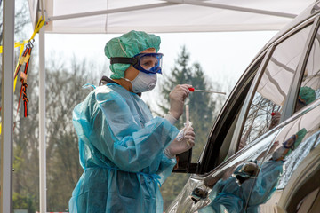 Nurse making a smear, Coronavirus Test on a Drive-In
