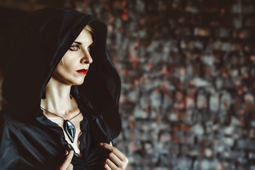 Naklejka premium the girl in the black hood