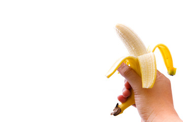 Ripe yellow bananas that have been peeled in the hand, isolated from a white background and copy space