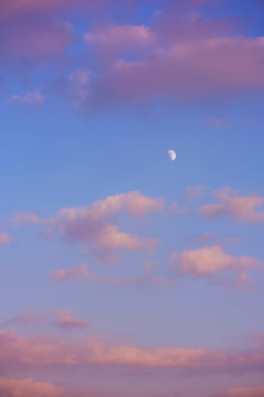 Evening sky with clouds and moon. Golden hours sky
