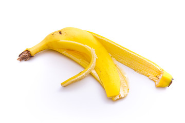 the ripe banana skin is yellow, isolated from a white background and copyspace