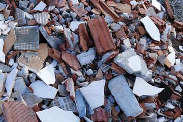 people pollute the environment they live in, concrete and brick remains, construction waste,