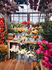 colorful flower shop with a garden figurine