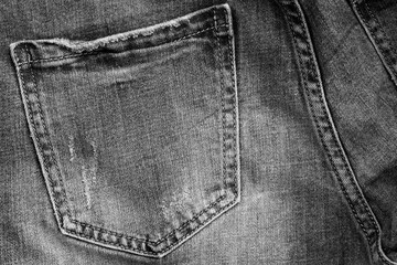 Black and white photo original vintage style jeans texture background.
