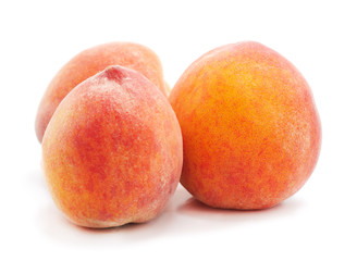 Three ripe peaches.