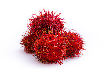 ripe red rambutan fruit, isolated white background and copyspace, scientific name: Nephelium lappaceum