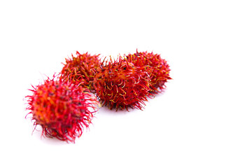 ripe red rambutan fruit, isolated white background and copyspace, scientific name: Nephelium lappaceum