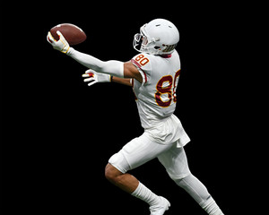 Great action photos of football players making amazing plays during a football game © Joe