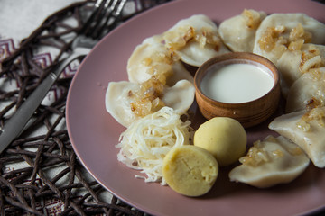 dumplings with stewed cabbage, homemade traditional Ukrainian dish varenyky