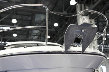 Denfort type anchor on bow of a motor yacht close up © Ilya