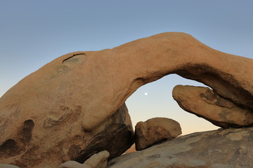 Arch rock with moon in Joshua Tree National Park - 331781936