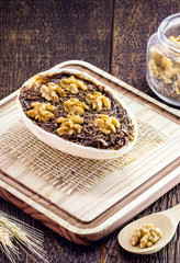 Chocolate egg with filling for Easter on wooden background. Selective focus, wooden background. Easter 2020.