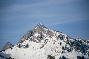 High alpine mountains with snow in Germany and blue beautiful sky