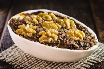 chocolate easter egg with icing and nut filling. Easter tradition of Brazil, creative and decorative egg.