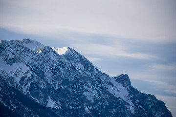 High alpine mountains with snow in Germany and blue beautiful sky