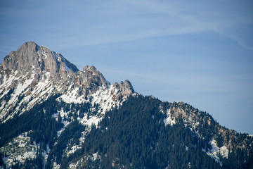 High alpine mountains with snow in Germany and blue beautiful sky