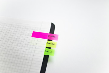 Colorful sticky notes in a notebook. Color stickers for notes