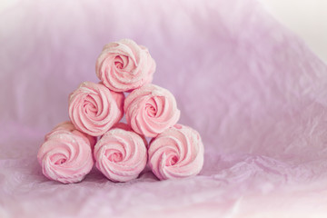Homemade pink marshmallows on pastel pink background. Creative concept Marshmallow, Meringue. Homemade Sweets dessert