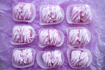 Homemade pink marshmallows on pastel pink background. Creative concept Marshmallow, Meringue. Homemade Sweets dessert