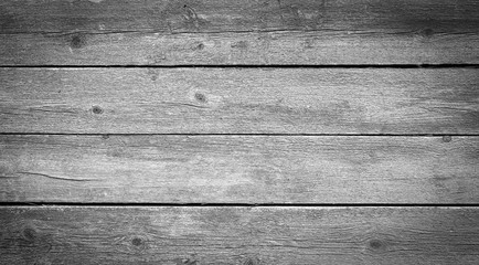 Naklejka premium Old gray wooden board background.