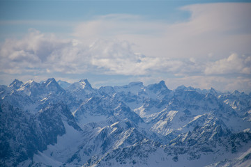 High alpine mountains with snow in Germany and blue beautiful sky