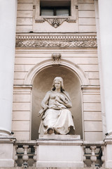 Obraz premium The sculpture muse of tragedy on the facade of the Opera and Ballet Theater in Lviv. Neoclassicism in architecture.