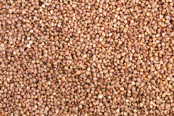 Natural texture or background with buckwheat. Closeup. Top view. Copy space.