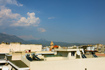 Sunny harbor and promenade of traditional town near the Corinthian gulf, Greece