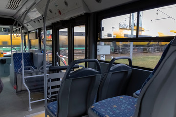Obraz premium Inside the city bus. Panoramic view from the rear seat.
