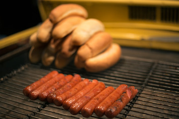 Delicious fresh hot dogs on the grill