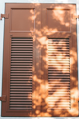 Old vintage wooden window in western european style
