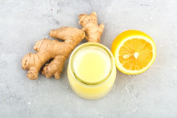 Health and diet content. Natural immune system support kit-ginger and lemon drink. Light gray background,close up