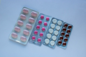 pharmaceuticals antibiotics pills medicine colorful antibacterials pills on white background. coronavirus concept
