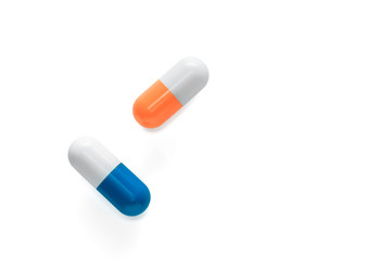 Falling pills isolated on white background