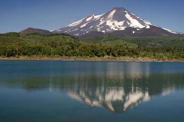 Llaima volcano reflected on the Conguillio lake.