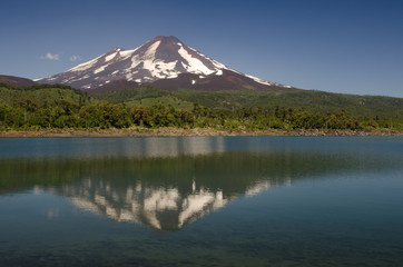 Llaima volcano reflected on the Conguillio lake.