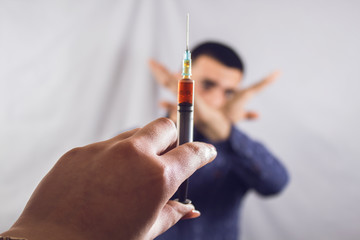 businessman refuses an injection