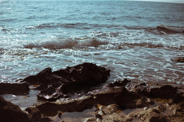 Fototapeta na wymiar Stones on the seashore in the afternoon