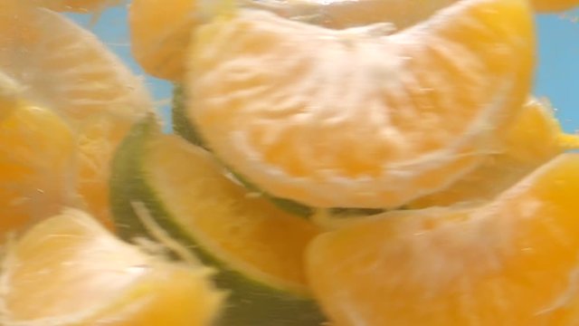 Mandarin Oranges Rotating in Water Slow Motion Macro