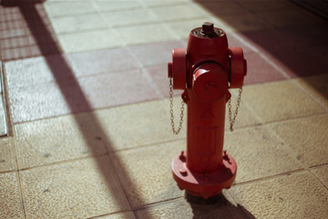 Old red fire hydrant in the city