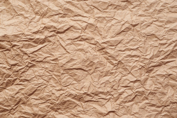Sheet of yellow wrinkled paper, closeup