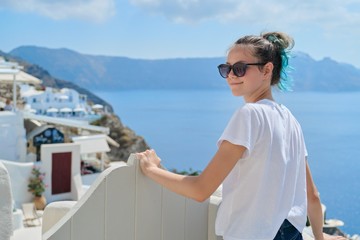 Fototapeta na wymiar Teenager girl resting on Greek island Santorini