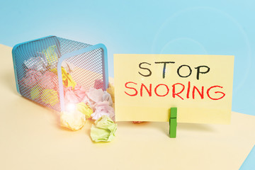 Handwriting text writing Stop Snoring. Conceptual photo noisy breathing during sleep due to...