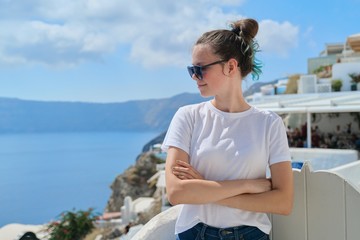 Fototapeta na wymiar Teenager girl resting on Greek island Santorini