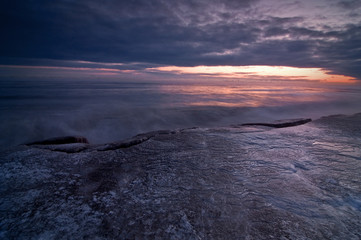 Great Lakes Winter Sunrise over Lake Michigan on a cold January morning at Openlands Lakeshore Preserve,. Fort Sheridan, Illinois.