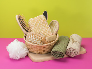 Bath set for bathroom in bright pink and green background.