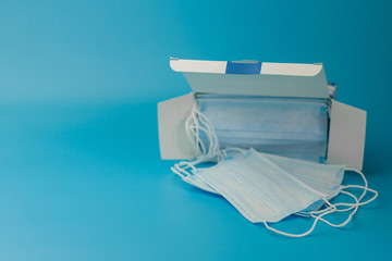 Medical respiratory bandage face on blue background. prevention of the spread of virus and pandemic COVID-19.